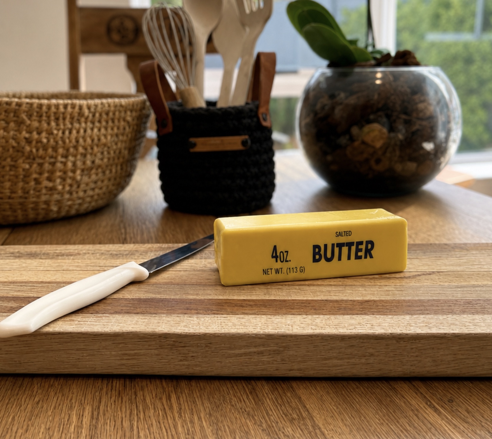 Small Butter Squishy on a wooden chopping board
